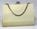 A very rare vintage evening bag with bakelite cover and chain handle